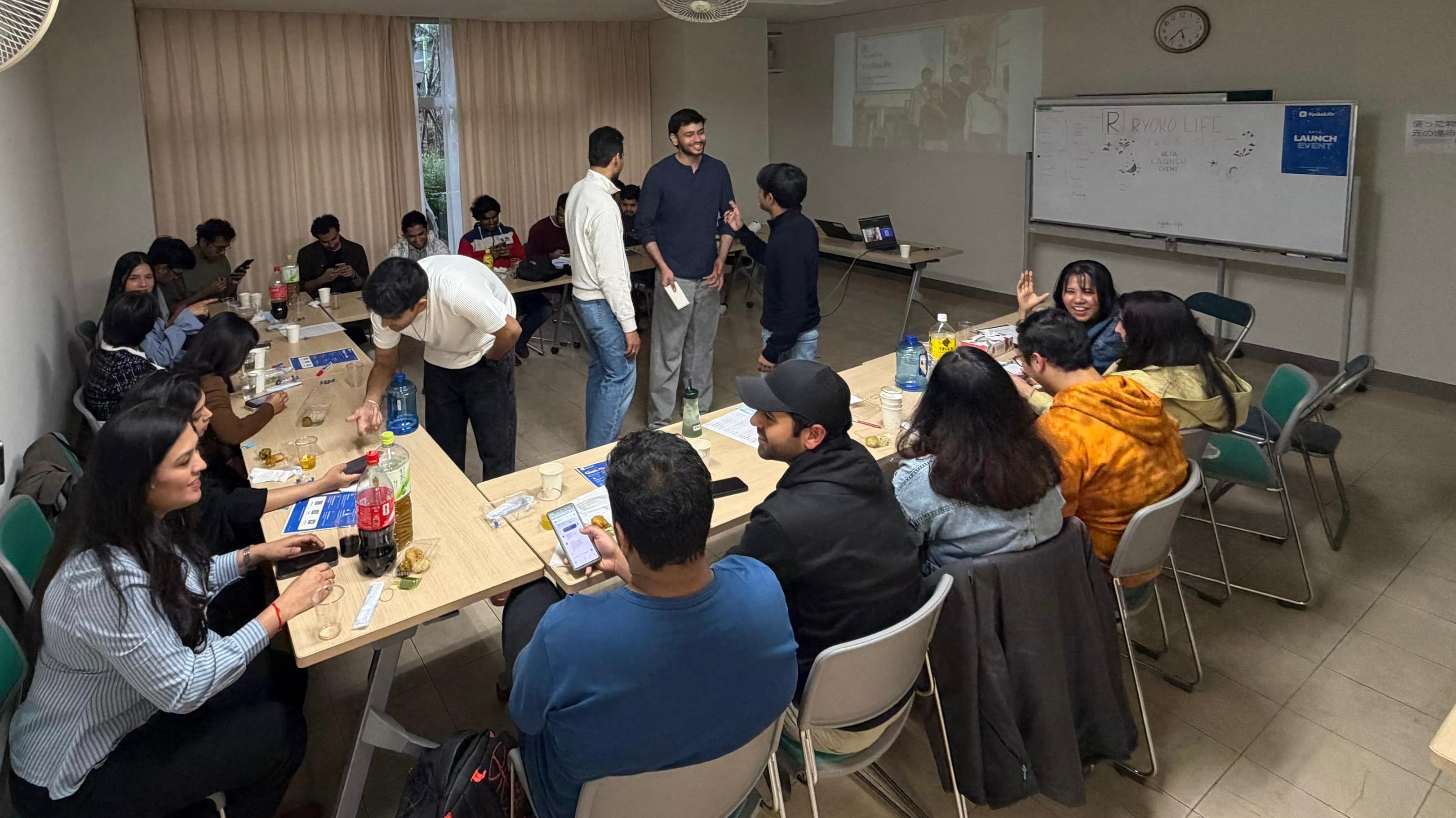 Groups around tables collaborating on a trip using RyokoLife